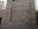 On the right side of the Pylons from right to the left: Prolomaeus XII turns to the Gods Horus and Hathor 